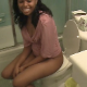 A pretty black girl who seems a little shy takes a piss into a commode, and then later takes a nice, log-shaped shit onto a styrofoam plate. Over 1.5 minutes.